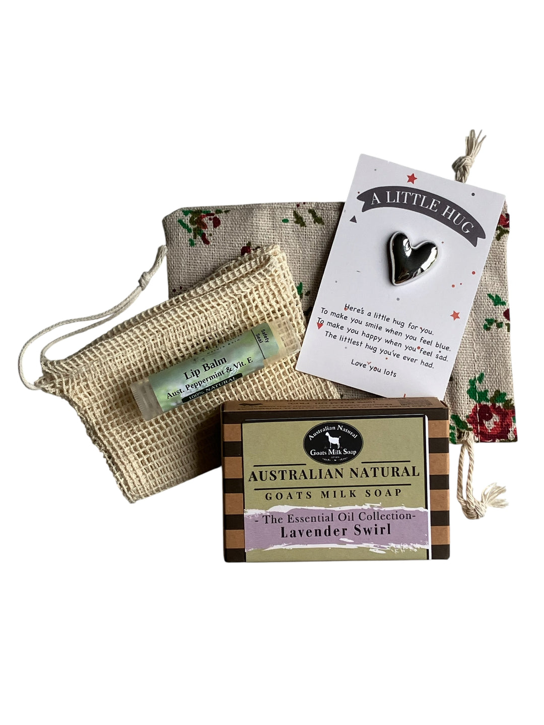 Set of Australian Natural Goats Milk Soap, lip balm, and a heart-shaped keychain on a white background.