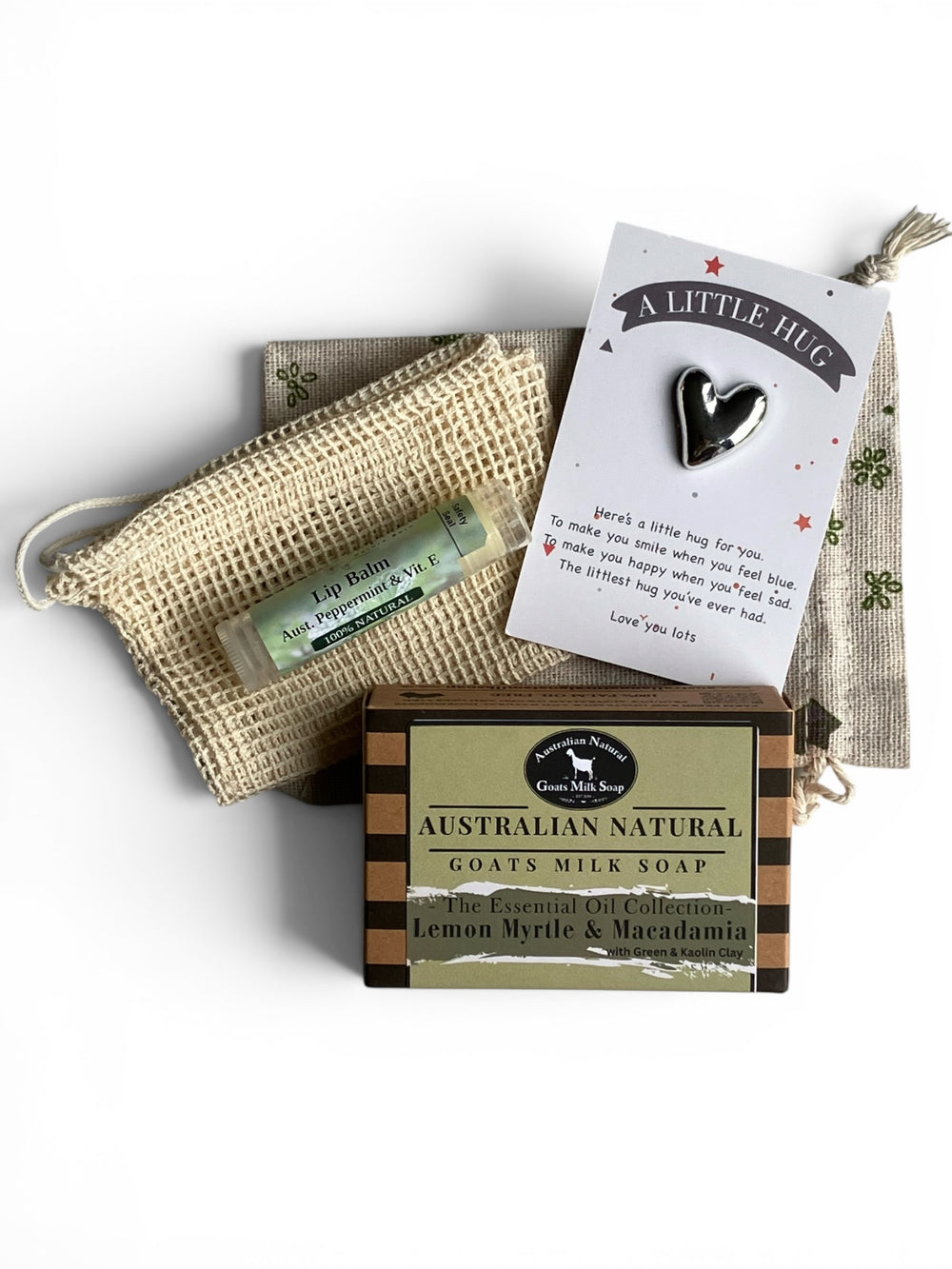 Australian natural goats milk soap with a heart-shaped pendant and lip balm on a white background